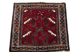 Surface texture of 2000s Shiraz rug with natural Wool and intricate pattern