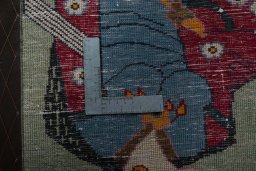 Backside of handmade 2000s Shiraz rug showing knot structure and weave density