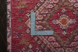 Backside of handmade 2000s Shiraz rug showing knot structure and weave density