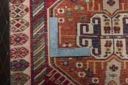 Backside of handmade 2000s Shiraz rug showing knot structure and weave density