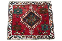 Surface texture of 2000s Shiraz rug with natural Wool and intricate pattern