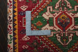 Backside of handmade 2000s Shiraz rug showing knot structure and weave density