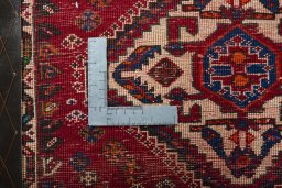 Backside of handmade 2000s Shiraz rug showing knot structure and weave density
