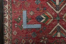 Backside of handmade 2000s Shiraz rug showing knot structure and weave density