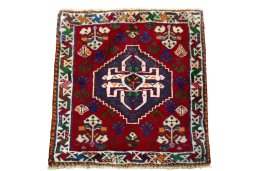 Surface texture of 2000s Shiraz rug with natural Wool and intricate pattern