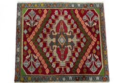 Surface texture of 2000s Shiraz rug with natural Wool and intricate pattern
