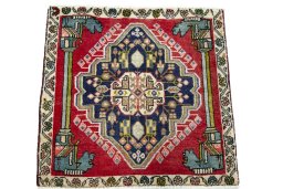 Surface texture of 2000s Shiraz rug with natural Wool and intricate pattern