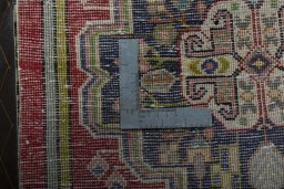 Backside of handmade 2000s Shiraz rug showing knot structure and weave density