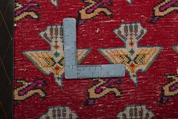 Backside of handmade 2000s Shiraz rug showing knot structure and weave density