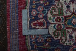 Backside of handmade 2000s Shiraz rug showing knot structure and weave density
