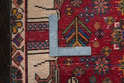 Backside of handmade 2000s Shiraz rug showing knot structure and weave density