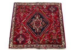 Surface texture of 2000s Shiraz rug with natural Wool and intricate pattern