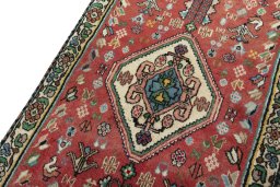 Backside of handmade New Shiraz rug showing knot structure and weave density