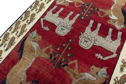 Backside of handmade 2000s Shiraz rug showing knot structure and weave density