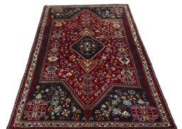 Surface texture of 2000s Shiraz rug with natural Wool and intricate pattern