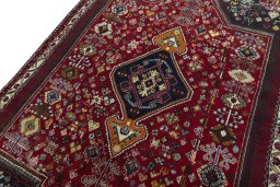 Backside of handmade 2000s Shiraz rug showing knot structure and weave density