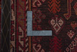 Surface texture of 2000s Shiraz rug with natural Wool and intricate pattern