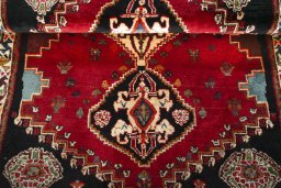 Corner detail of 2000s Shiraz rug showing border pattern and Wool pile