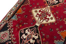 Backside of handmade 2000s Shiraz rug showing knot structure and weave density