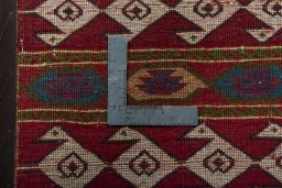 Backside of handmade 1970s Shiraz rug showing knot structure and weave density