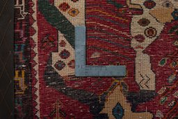 Backside of handmade 1970s Shiraz rug showing knot structure and weave density