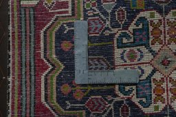 Backside of handmade 1970s Shiraz rug showing knot structure and weave density
