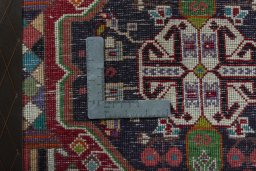 Backside of handmade 1970s Shiraz rug showing knot structure and weave density