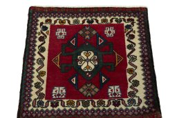 Surface texture of 1970s Shiraz rug with natural Wool and intricate pattern
