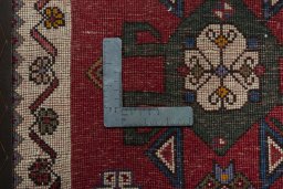 Backside of handmade 1970s Shiraz rug showing knot structure and weave density