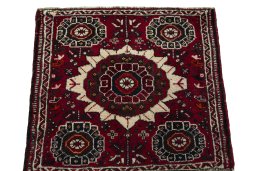 Surface texture of 1970s Shiraz rug with natural Wool and intricate pattern