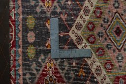 Backside of handmade 1970s Shiraz rug showing knot structure and weave density