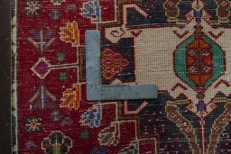 Backside of handmade 1970s Shiraz rug showing knot structure and weave density