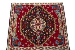 Surface texture of 1970s Shiraz rug with natural Wool and intricate pattern