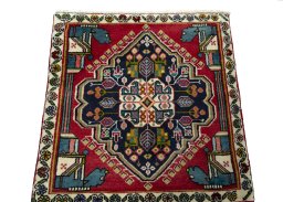Surface texture of 1970s Shiraz rug with natural Wool and intricate pattern