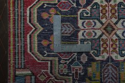 Backside of handmade 1970s Shiraz rug showing knot structure and weave density