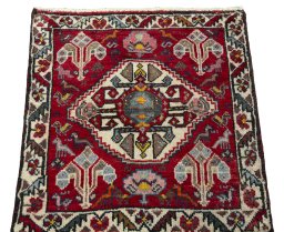 Surface texture of 1970s Shiraz rug with natural Wool and intricate pattern