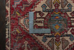 Backside of handmade 1970s Shiraz rug showing knot structure and weave density