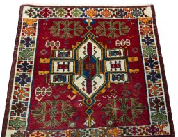 Surface texture of 1970s Shiraz rug with natural Wool and intricate pattern