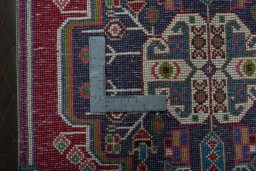 Backside of handmade 1970s Shiraz rug showing knot structure and weave density