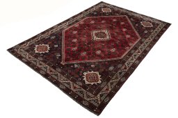 Corner detail of 2000s Shiraz rug showing border pattern and Wool pile