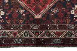 Close-up detail of 2000s Shiraz rug from Iran / Persia showing Wool weave