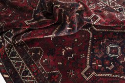 Corner detail of 2000s Shiraz rug showing border pattern and Wool pile
