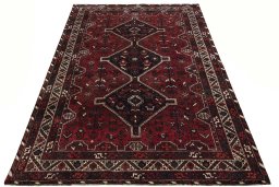 Surface texture of 2000s Shiraz rug with natural Wool and intricate pattern