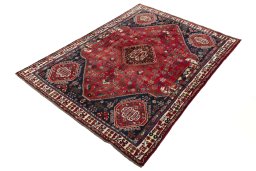 Corner detail of 2000s Shiraz rug showing border pattern and Wool pile