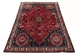 Surface texture of 2000s Shiraz rug with natural Wool and intricate pattern