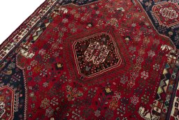 Backside of handmade 2000s Shiraz rug showing knot structure and weave density
