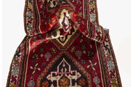 Corner detail of 2000s Shiraz rug showing border pattern and Wool pile