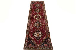 Surface texture of 2000s Shiraz rug with natural Wool and intricate pattern