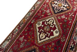 Backside of handmade 2000s Shiraz rug showing knot structure and weave density