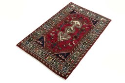 Corner detail of 2000s Shiraz rug showing border pattern and Wool pile
